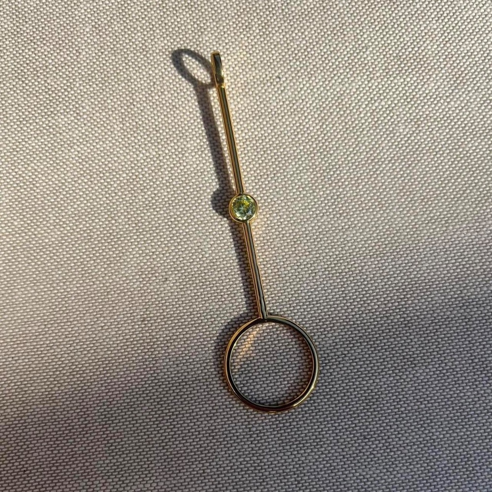 Gold plated with green stone cigarette holder/joint holder ring.